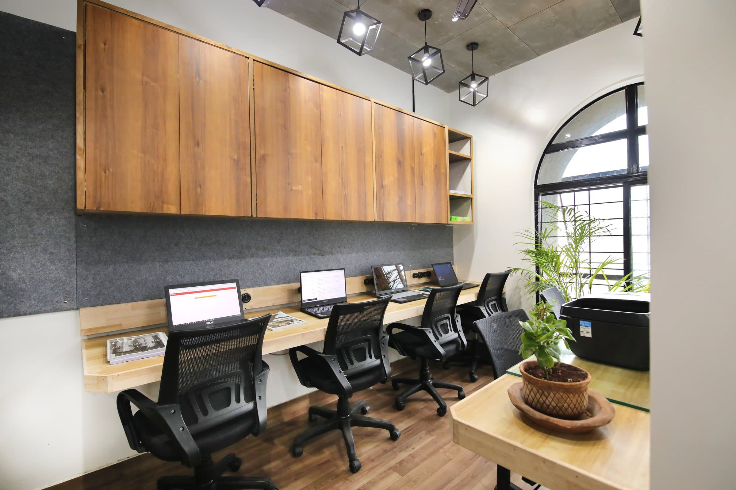 An industrial-loft studio anchored by a striking blue resin table — photo 7 of 16