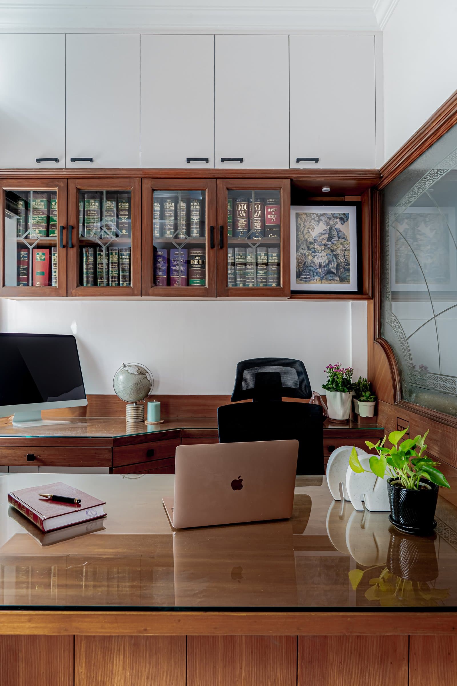 A dense, book-lined chamber softened by one unexpected detail — photo 5 of 8