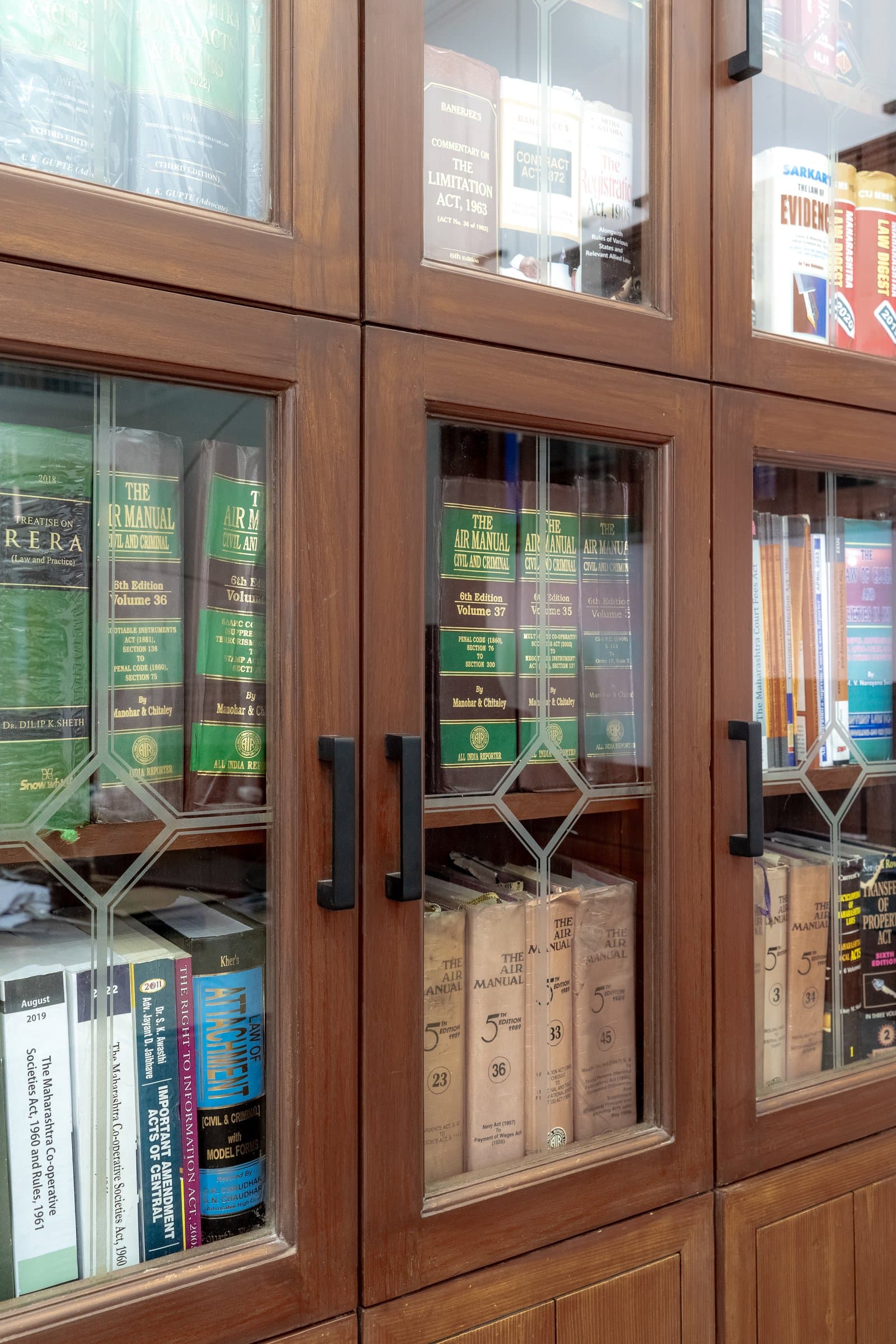 A dense, book-lined chamber softened by one unexpected detail — photo 7 of 8