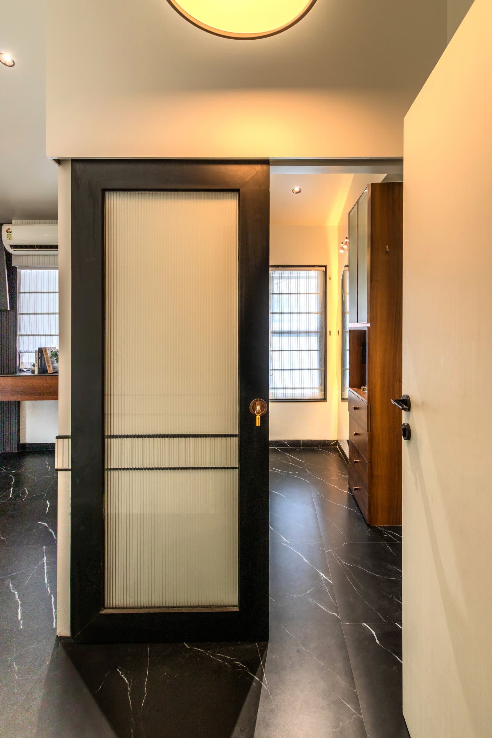 A 700 sq. ft. bedroom where storage disappears into every corner — photo 23 of 23